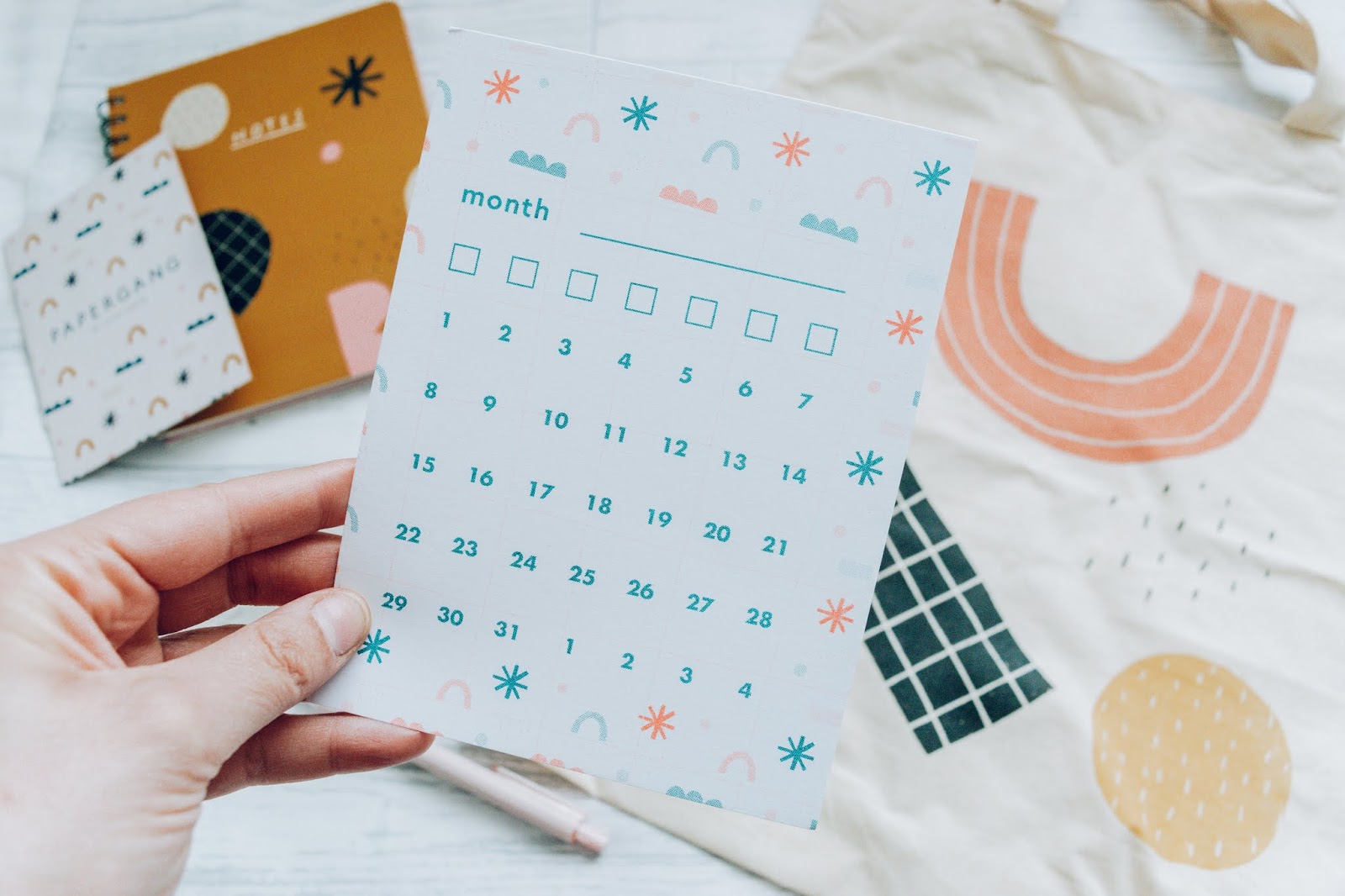 A blank month calendar card with geometric shapes all over