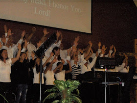 Lifting hands in praise and honor!