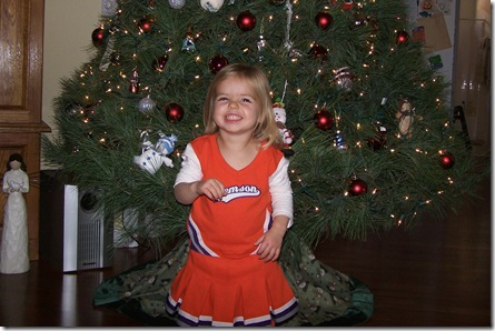 Cheerleader in Front of Tree