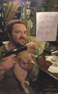 Bam Margera Pointing a Gun to His Dog