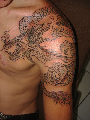 dragon tattoos for men on arm. dragon tattoo art. Label: Arm