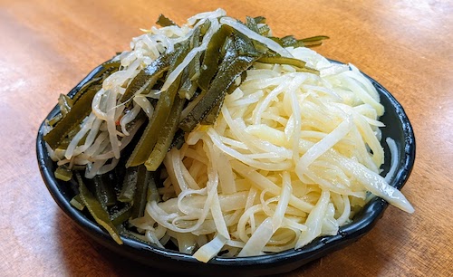 Shredded hot and sour potatoes and seaweed salad