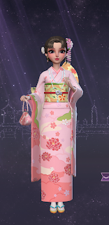 Yuko in a traditional pink kimono with beaded floral decorations hanging from her hair