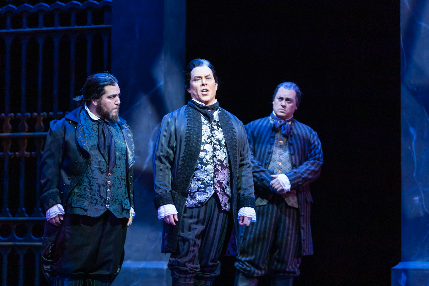 IN REVIEW: (from left to right) tenor JACOB KATO as Spoletta, baritone MALCOLM MACKENZIE as Scarpia, and baritone TED FEDERLE as Sciarrone in North Carolina Opera's April 2019 production of Giacomo Puccini's TOSCA [Photograph by Eric Waters, © by North Carolina Opera]