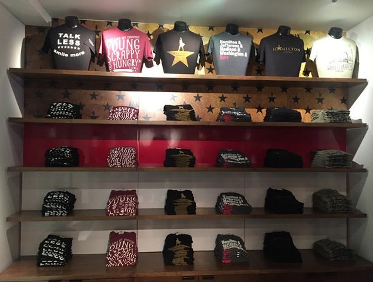 photo of the tee shirts in a wall display at the store