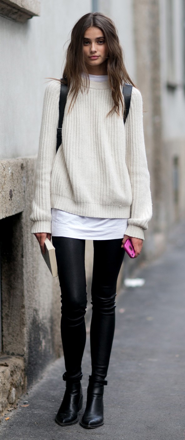 trendy fall outfit / white sweater + top + black leggings + boots