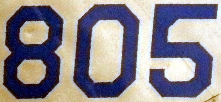  805 is divisible by the sum of its prime factors.