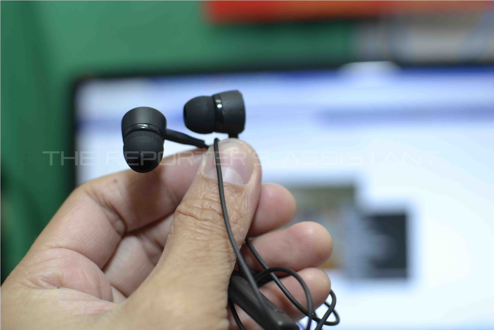 Together with the package is an earbud type earphone for an atomic ...