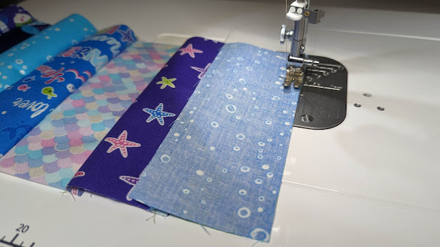 Sewing rectangles together for the quilt top