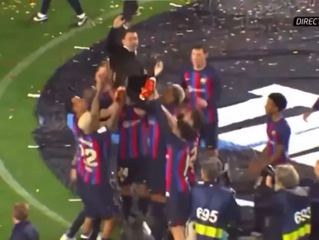 Spotted: Barca players toss Xavi in the air to celebrate La Liga success