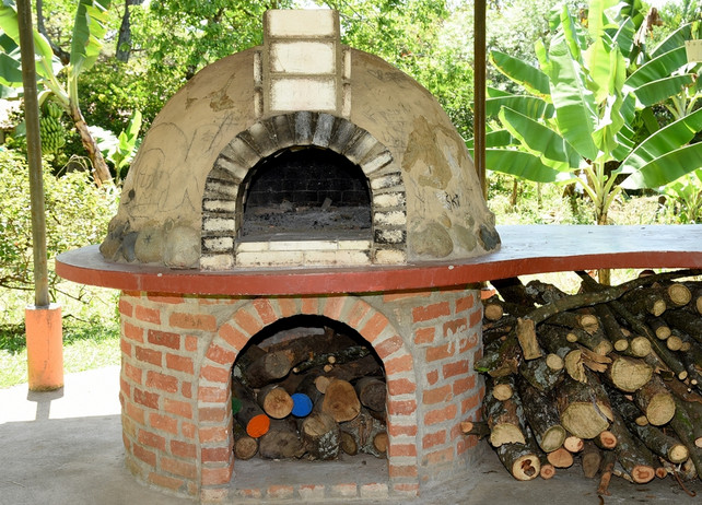 A hearth oven can be used as a backyard barbecue.