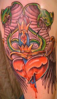 Tattoo of Dagger Stabbing a Heart