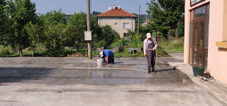 Bekir and Halil tidying up the patio