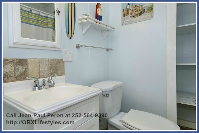 Enjoy a relaxing bath in any of the 2 full baths of this 3 bedroom oceanfront home for sale in Carova NC. 