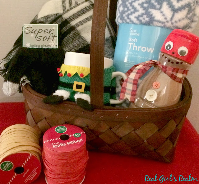 Make a Cozy Themed basket that has everything you need for a snowy day, curled up on the couch, including a cocoa-filled snowman!