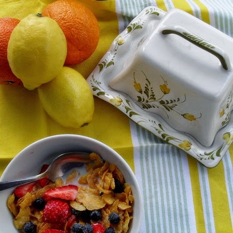 first outdoor breakfast with the first ripe strawberry