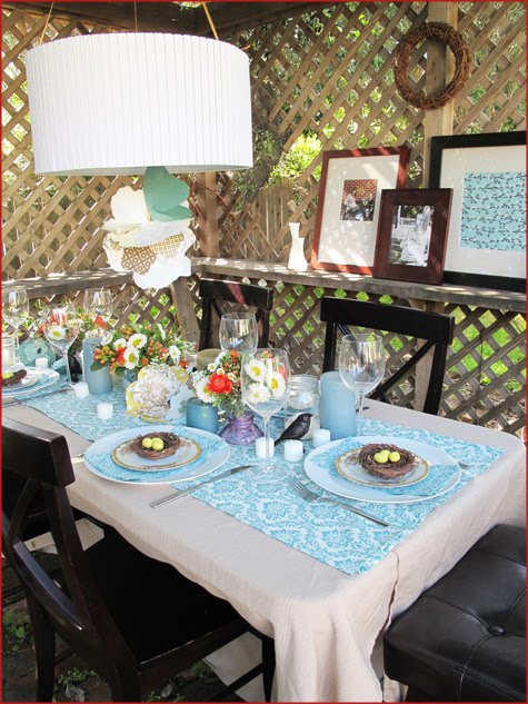 The table settings inside the gazebo featured mason jars milk glass vases