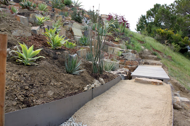 Partially completed path leading to foot bridge