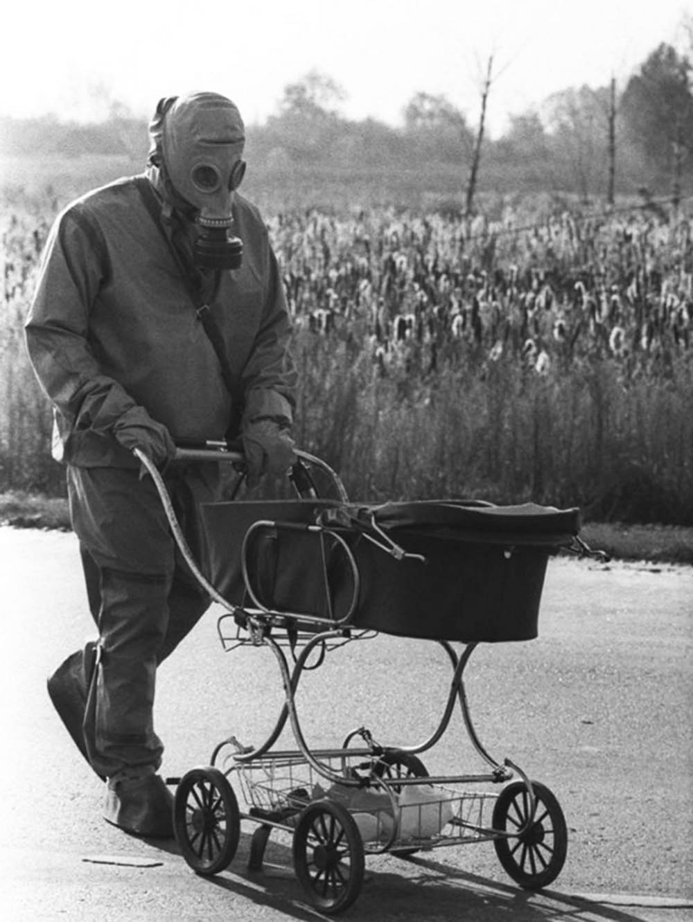 A Chernobyl liquidator pushes a baby in a carriage who was ...
