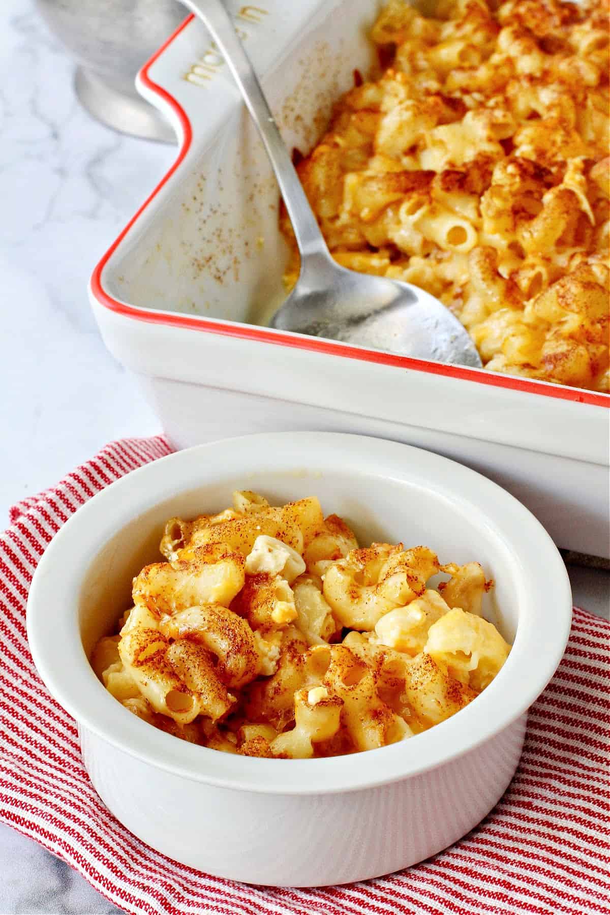 Baked Macaroni and Cheese serving in a white bowl.