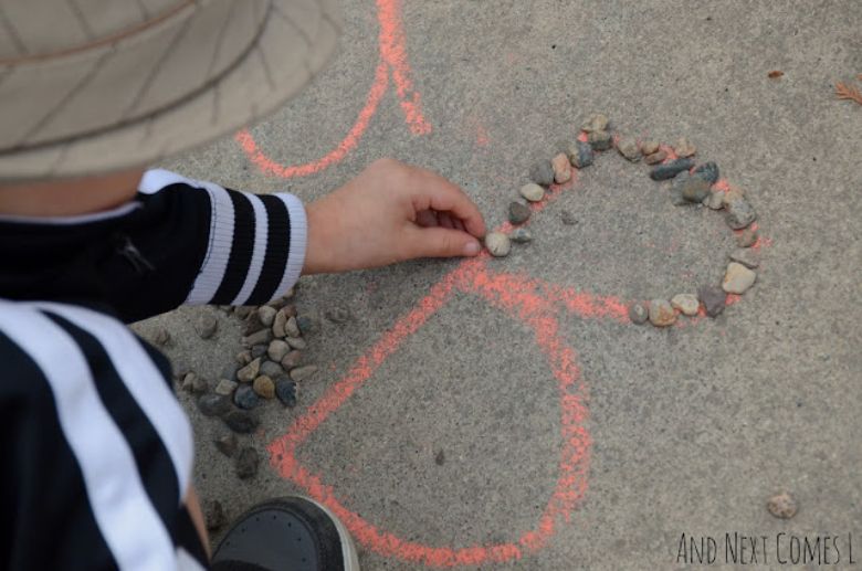 Alphabet tracing with chalk and rocks - outdoor alphabet activity for preschoolers
