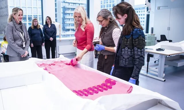 Crown Princess Mette-Marit wore a vintage classic woolrich maxi coat. Fuchsia sweater. Aurora Workshop