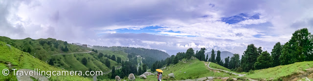   The current hot and humid climate makes you want to escape to a pretty place where there's soft drizzle and a cool breeze blowing. However, the current pandemic has made this a distant dream. Today if someone asks me which is that one place I want to disapparate to, I would name the Dain Kund Trek in Dalhousie without any hesitation. This is the place that is like a tiny slice of heaven and I hope it stays that way. One cannot spend too much time here and it is not a very long or challenging trek, but if you happen to be here at the right time, you will experience bliss.      Today in this Time Turner post, we will look back at those few hours we spent on this trek. The Time-Turner series is my opportunity to pen down the lingering memories and impressions of a place I have visited. It helps me relive the experience a bit and also reflect upon the aspects of the place that stood out the most to me. For more Time-Turner posts, follow this link: The Time-Turner Series.        We did part of this trek during what is considered one of the worst seasons for any trek, monsoon. It is very risky to embark on such an adventure during rains, please take precautions. We did. We wore the right shoes, made sure it wasn't raining and also most of us (all except me) are native Himachalis so trekking is in their blood.       The entrance to the trek is close to a view point near the Dalhousie-> Chamba road. It is next to the IAF station. From their, a short paved path (about a kilometer long) takes you to a concrete canopy where you can rest and take in the views. The hills (at least in monsoon) is lush green and if you are lucky, you will find yourself surrounded by clouds. We did.       However, we were exceptionally lucky because sun was kind of playing hide and seek with us. So while we got some dramatic shots with clouds darting in, we also got some photographs with great natural light. We had started early so there was absolutely no one around. However, by the time we had finished the trek and come back, visitors had started pouring in and we knew it wasn't going to be as peaceful anymore.       However, moving on, after the canopies, the path isn't well paved anymore, but it is smooth and flat enough. There are short spurs of hikes, but it is all mostly manageable, unless you are with elderly or very small children. Our 3 year old niece managed the whole trek on foot, so that should give you some context. The entire trek from the entrance is about 3 kilometres long and that makes the entire walk about 6 kilometres.       All through these 3 kilometres, you are walking amidst forest of tall deodars that often give way to lush green hills. And each turn reveals a completely new view. Sometimes you are looking at snow-clad mountains in the distance and sometimes you can observe ponies grazing on soft grass.      The trek culminates at a simple but rather lovely temple of Pohlani Devi. You can offer prayers there. Have tea and snacks at a shop at the summit and soak in the natural beauty all around you. This is an experience you will never forget if you time it right.       Till today, the memory is as fresh as it was back then. And if I try really hard, I can still smell the fresh grass and wildflowers growing all around. This is definitely an experience I would like to revisit if I had a Time Turner.  