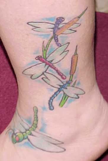 Dragonfly tattoos are very rangy in both style and size, as we see a few of 