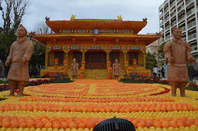 Pic of patterns of oranges and lemons with a Chinese theme and figures