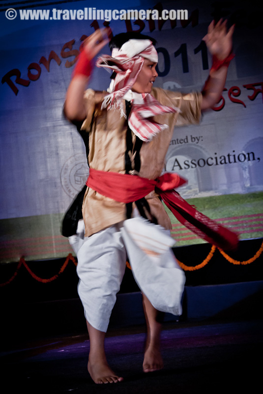 A Marvelous dance performance by troop of lovely school children on Bihu songs @ Rogali Bihu Festival at Indira Gandhi National Center of Art (24th April, 2011) : Posted by VJ SHARMA on www.travellingcamera.com : Recently I witnessed Rogali Bihu Festival at Indira Gandhi National Center of Art which was organized Assam Organization, Delhi !!! among various Bihu performances, these children presented a shining dance performance with cute expressions at each step... Check Out !!!Smallest girl in the troop and was leading one side of the sub-group on stage.. She was really enjoying dance with amazing expressions on her face and I assume expressions were changing as per the lyrics of the song !!! I am not sure because I could not understand Assamese...While other performances were going on the stage, these kids were roaming around the stage and it seemed that limit of their wait has crossed !!!Enthusiasm of all the kids was unmatchable and till the end they were like that only !!!If I am not missing anything, there were only two boys surrounded by all the girls !!! During the end part, a boy dressed up as old man entered and performance finished after some conversations between the lead person on the stage and the old man !!!These children look so pretty in Assamese sari's. This girl's smile reminds me of Vayjanthimala.Cute group of School children performing Bihu dance in sync @  Rongali Bihu Festival in Delhi, INDIA !!For such a sustained and consistent performance, these children would have had to go through several hours of practice. Kudos to them and their teachers for the achievement.Somehow synchronization is always a challenge with child dancers but that adds to the innocense of it all.Some steps were fairly complicated but the children were obviously enjoying themselves to the core.It was all done with the intention of having fun as well as performing for an audience.Saris were similar yet not the same. Some performers were obviously younger than the others. Yet age did not seem to make much difference to the quality of performances.Expressions were mature and could very well have been used in a drama. I don't know what the song was saying but it was easy to make out the gist from the expressions of these dancers cum actors.This seems to be a common step in this form of dance. Almost all performances included this.Highly enthusiastic and energetic performance by children. They were the life of the party.I hope these children keep performing and help in keeping the traditional dances alive. Preserving culture is very important. It is what gives each community its unique identity.