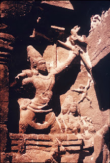 Tripurantaka-Shiva, riding the cosmic chariot and wielding the cosmic bow; stone temple carving, Ellora.