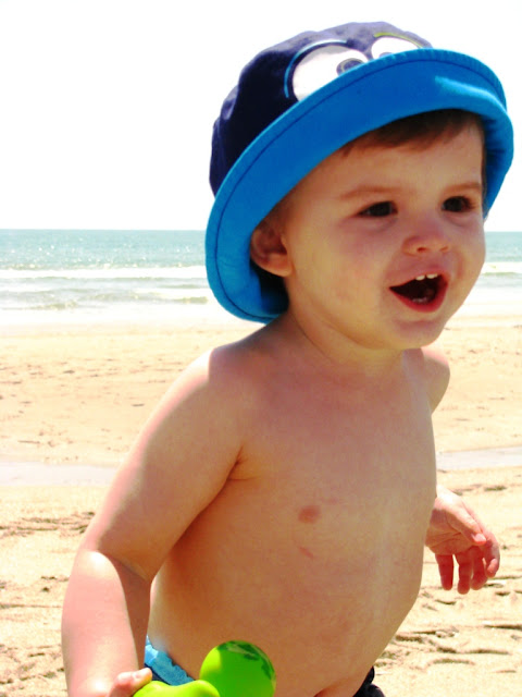 Toddler playing on the beach