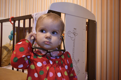 a small girl in the child's room, thinking,playing