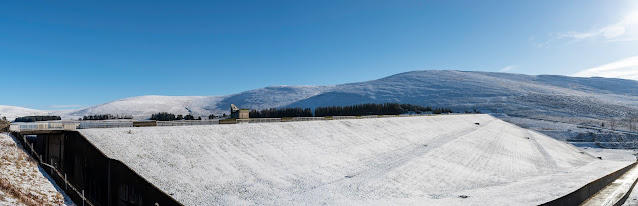 Backwater dam in snow, taken from the car park, showing the runoff channel