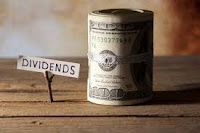 Dividend Sign with Dollars