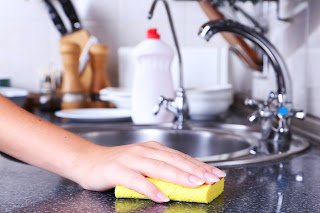 wiping kitchen counters