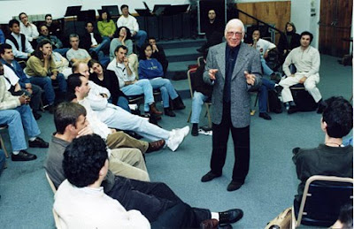 In this 1999 photo, Jerry Goldsmith tells a UCLA film music class that if you ever run into one of those record company execs who are responsible for those 'Music from and Inspired by...' collections of songs that aren't even in the movie, feel free to kick the shit out of him.