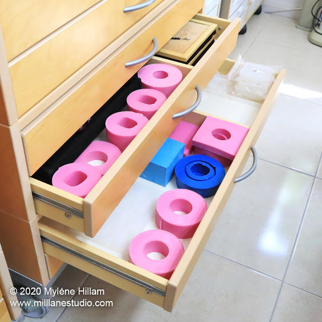 Flat drawers filled with pink and blue resin bangle moulds