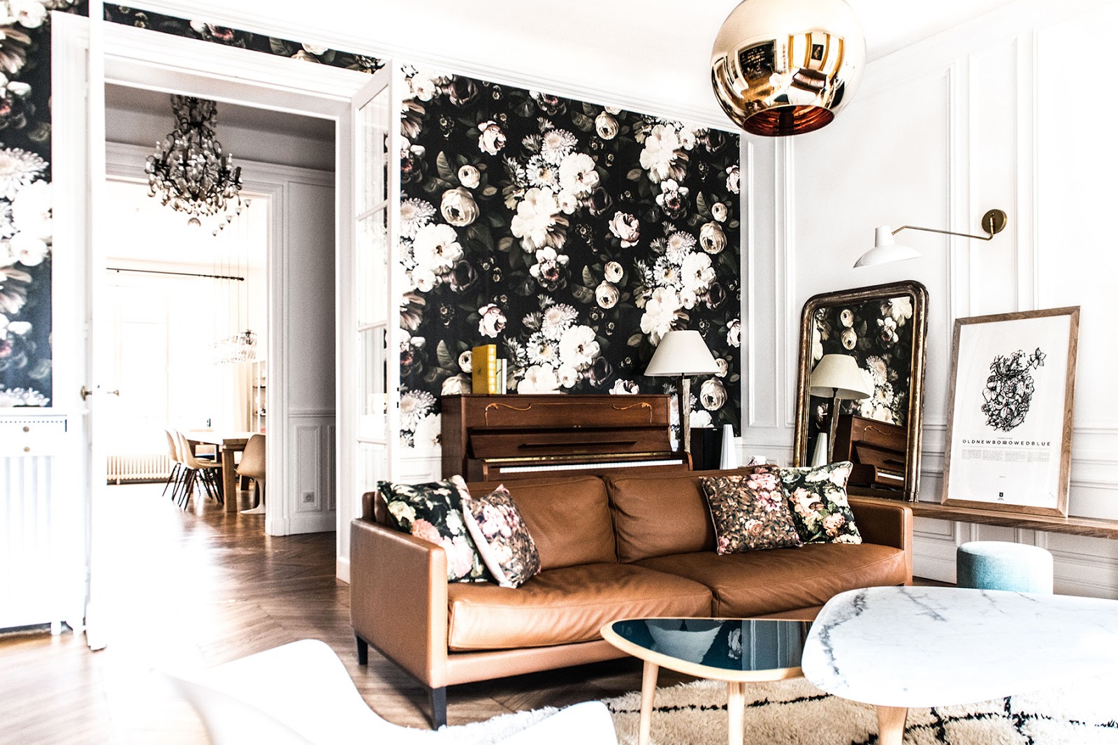 bohemian and chic paris apartment with parquet floors, eames and saarinen chairs, tom dixon lamps and wallpapers