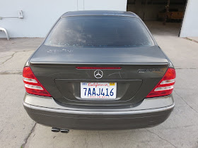 Peeling paint & old color on Mercedes before being repainted at Almost Everything Auto Body