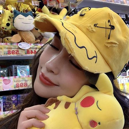 Angelababy with pikachu toy