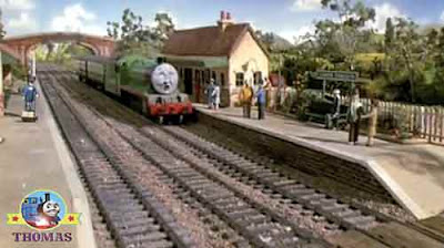 Lower Tidmouth station platform people waiting with Henry the green engine on a railway train bridge