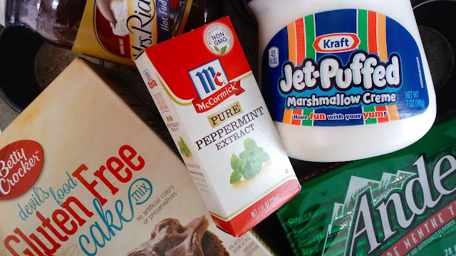 a box of cake mix, a jar of marshmallow cream, a jar of hot fudge, a box of peppermint extract, and a package of Andes chocolate mints