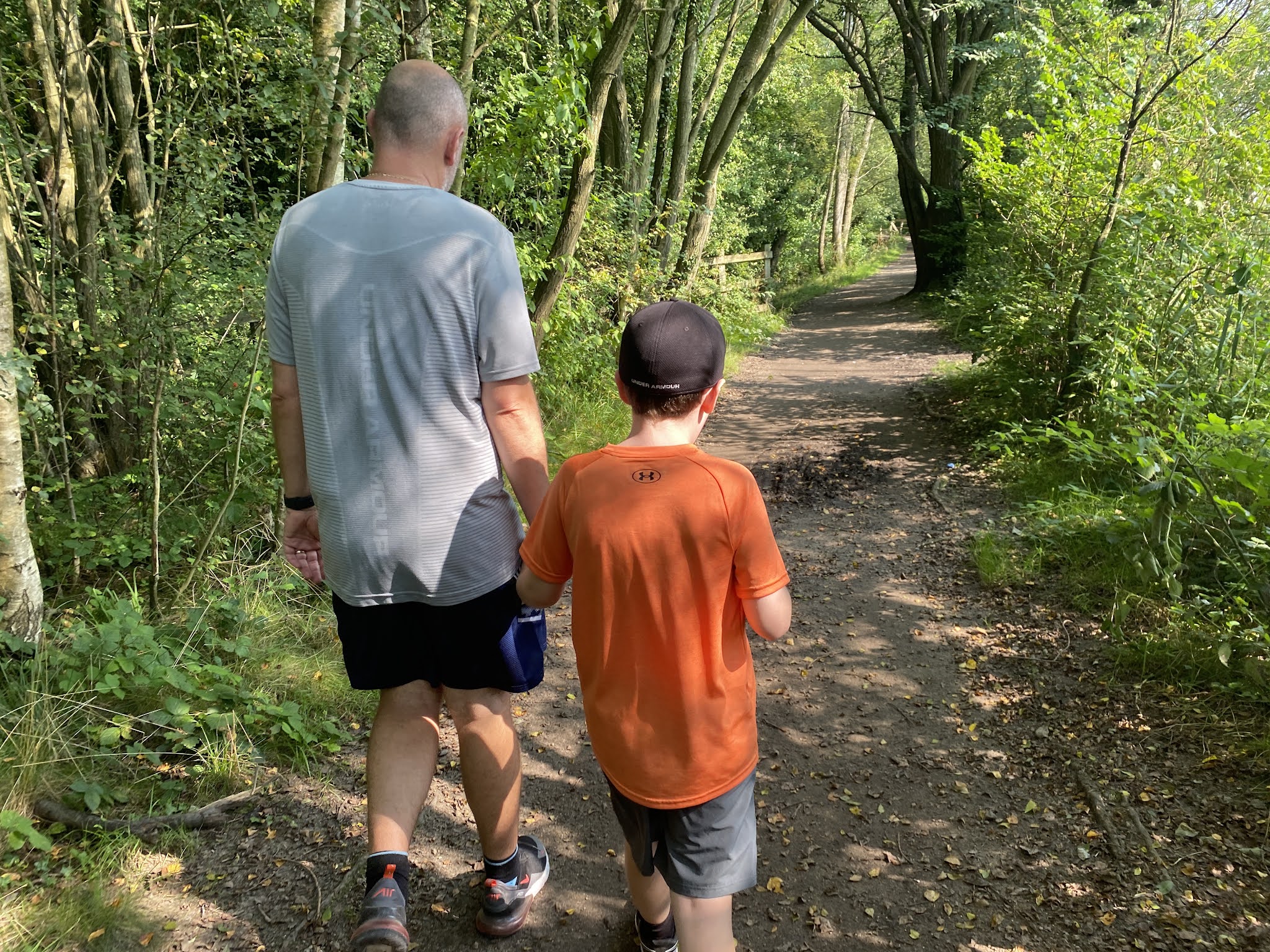 dad and son walking