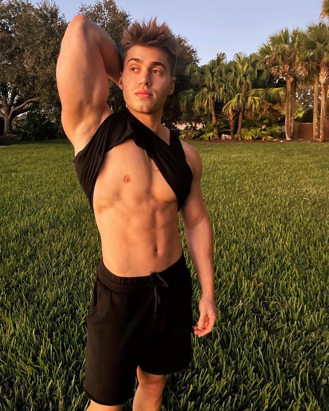 pretty-dreamy-young-bodybuilder-aaron-miller-lifting-tshirt