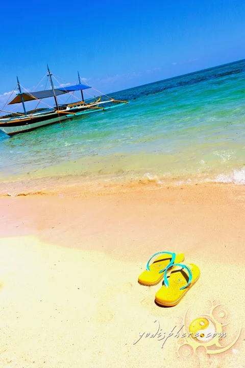 hover_share Colorful boat and calm scene of Maniwaya beach