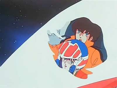 Hikaru and Minmay are amazed to find themselves in outer space.