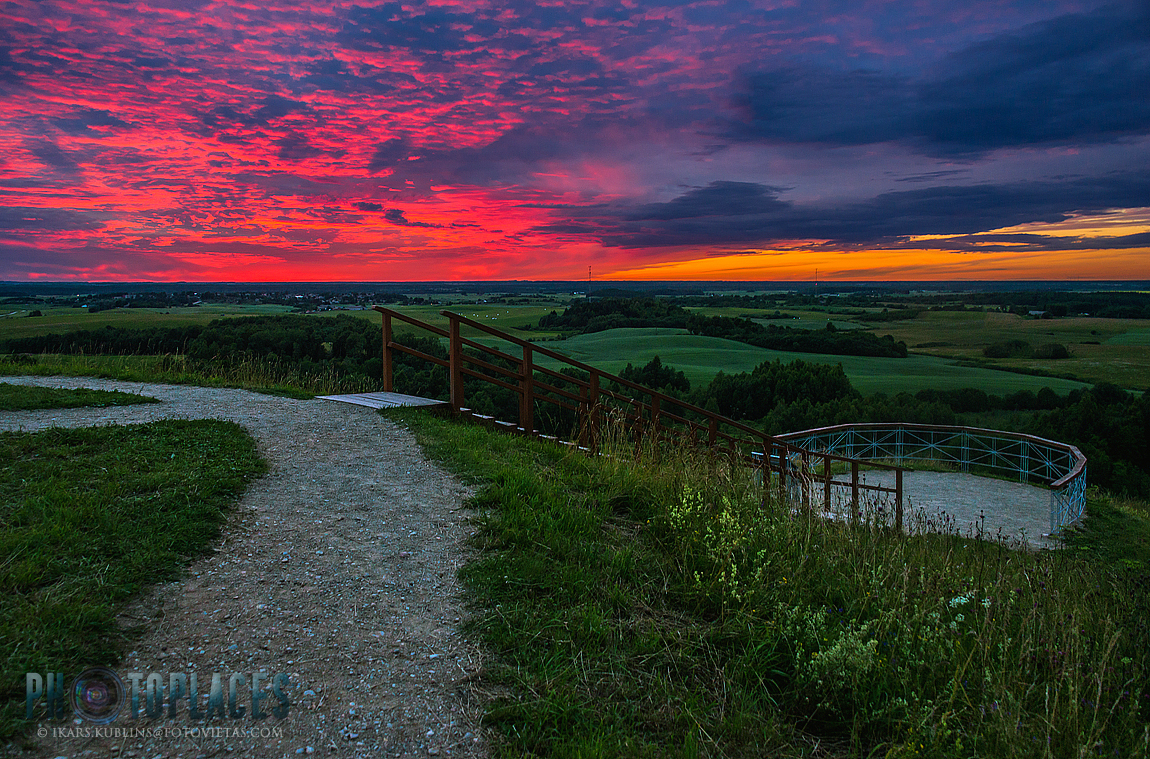amazing view from Šatrija hill over Lithuania countryside in summer sunset time with colorful sky