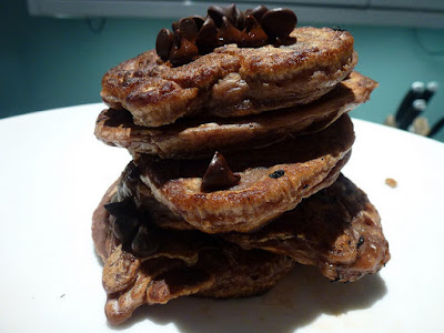 Stack of chocolate pancakes on a white plate