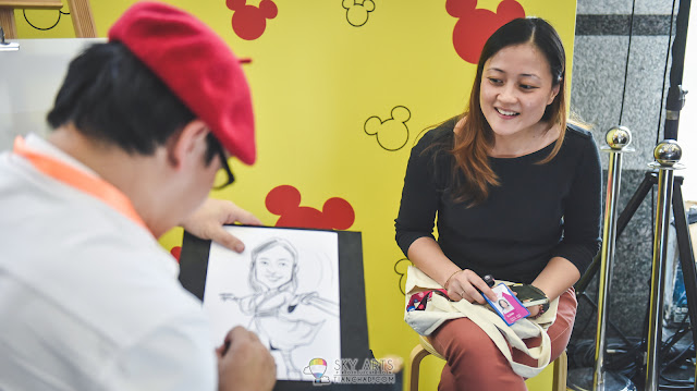 Cartoonist Portrait sketch at Disney Booth with occasional appearance of Mickey